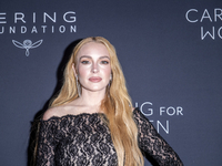 Lindsay Lohan attends Kering's 3rd Annual Caring for Women Dinner at The Pool in New York, USA, on September 9, 2024. (