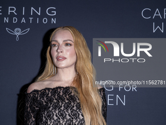 Lindsay Lohan attends Kering's 3rd Annual Caring for Women Dinner at The Pool in New York, USA, on September 9, 2024. (