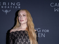 Lindsay Lohan attends Kering's 3rd Annual Caring for Women Dinner at The Pool in New York, USA, on September 9, 2024. (