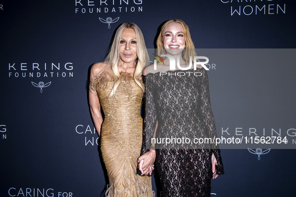 Donatella Versace and Lindsay Lohan attend Kering's 3rd Annual Caring for Women Dinner at The Pool in New York, USA, on September 9, 2024. 