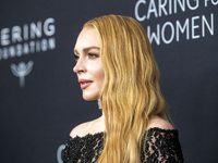 Lindsay Lohan attends Kering's 3rd Annual Caring for Women Dinner at The Pool in New York, USA, on September 9, 2024. (