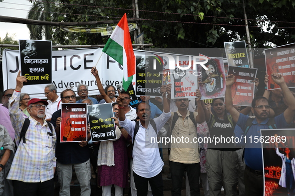 Citizens shout slogans during a protest against the rape and murder of a PGT woman doctor at the government-run R G Kar Medical College and...