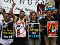 Citizens shout slogans during a protest against the rape and murder of a PGT woman doctor at the government-run R G Kar Medical College and...