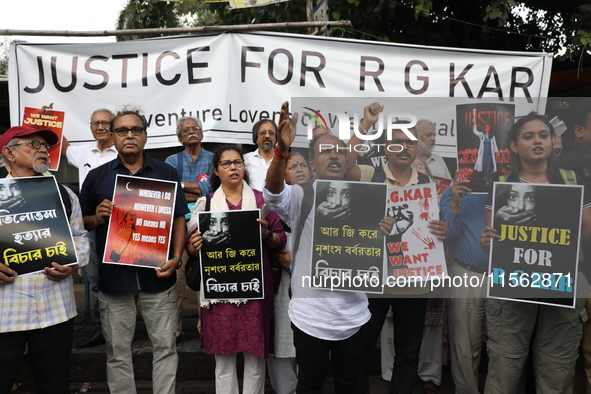 Citizens shout slogans during a protest against the rape and murder of a PGT woman doctor at the government-run R G Kar Medical College and...