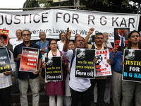 Citizens shout slogans during a protest against the rape and murder of a PGT woman doctor at the government-run R G Kar Medical College and...