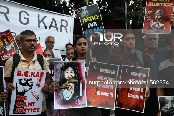 Citizens shout slogans during a protest against the rape and murder of a PGT woman doctor at the government-run R G Kar Medical College and...