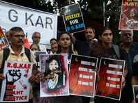 Citizens shout slogans during a protest against the rape and murder of a PGT woman doctor at the government-run R G Kar Medical College and...