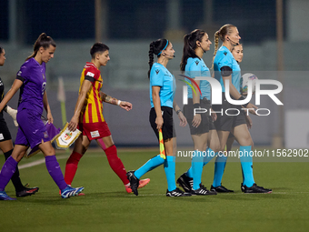 UEFA-appointed match referee Tatyana Sorokopudova leads her assistant referees, fourth official, and team captains onto the pitch prior to t...