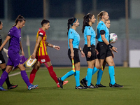 UEFA-appointed match referee Tatyana Sorokopudova leads her assistant referees, fourth official, and team captains onto the pitch prior to t...