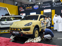 Visitors look at hunting vehicles during the 8th edition of the Katara International Hunting and Falcons Exhibition 2024 (S'hail) at Katara...