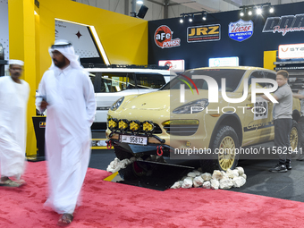 Visitors look at hunting vehicles during the 8th edition of the Katara International Hunting and Falcons Exhibition 2024 (S'hail) at Katara...