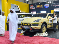 Visitors look at hunting vehicles during the 8th edition of the Katara International Hunting and Falcons Exhibition 2024 (S'hail) at Katara...