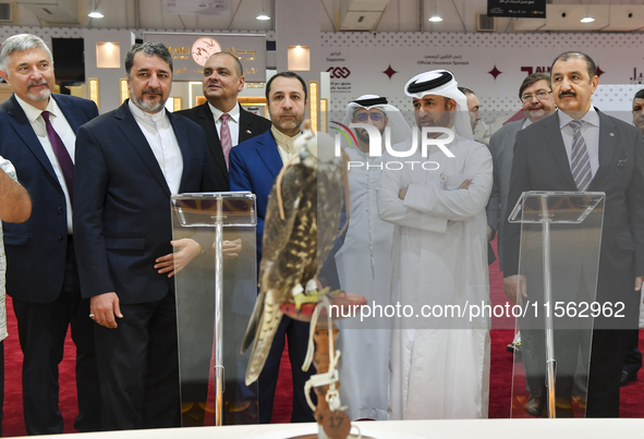 Qatari visitors observe falcons during the 8th edition of the Katara International Hunting and Falcons Exhibition 2024 (S'hail) at Katara Cu...