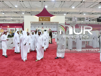 Qatari visitors attend the 8th edition of the Katara International Hunting and Falcons Exhibition 2024 (S'hail) at Katara Cultural Village i...