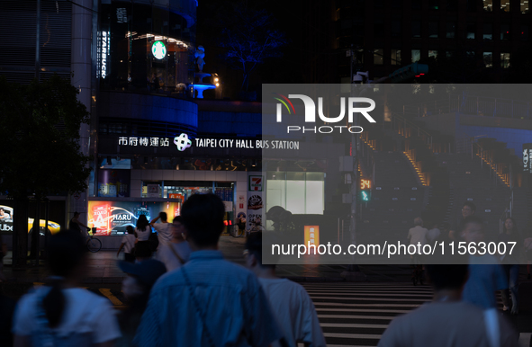 Pedestrians cross the street in Taipei, Taiwan, on September 10, 2024. 