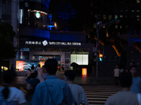 Pedestrians cross the street in Taipei, Taiwan, on September 10, 2024. (