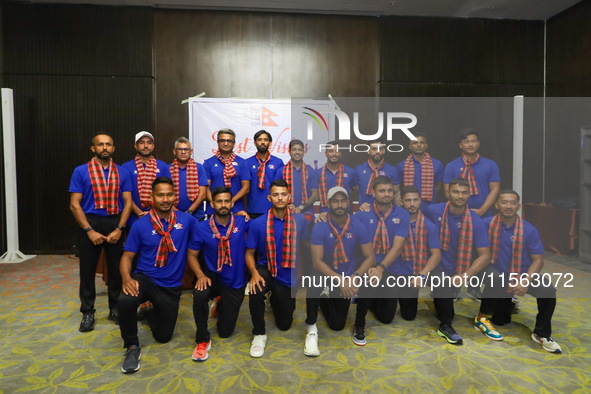 Officials and players from the Nepali national cricket team pose for a photo as they depart from Kathmandu, Nepal, on September 10, 2024. Ne...