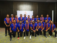 Officials and players from the Nepali national cricket team pose for a photo as they depart from Kathmandu, Nepal, on September 10, 2024. Ne...