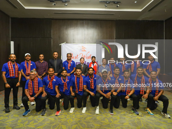 Officials and players from the Nepali national cricket team pose for a photo as they depart from Kathmandu, Nepal, on September 10, 2024. Ne...