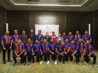 Officials and players from the Nepali national cricket team pose for a photo as they depart from Kathmandu, Nepal, on September 10, 2024. Ne...