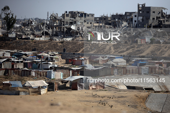 Displaced Palestinians shelter in a tent camp amid the Israel-Hamas conflict in the Al-Mawasi area in Khan Younis, in the southern Gaza Stri...