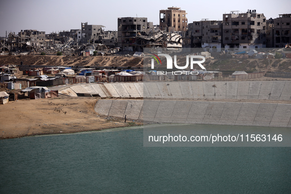 Displaced Palestinians shelter in a tent camp amid the Israel-Hamas conflict in the Al-Mawasi area in Khan Younis, in the southern Gaza Stri...