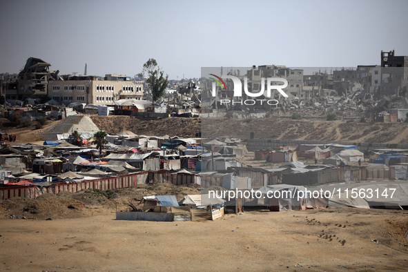 Displaced Palestinians shelter in a tent camp amid the Israel-Hamas conflict in the Al-Mawasi area in Khan Younis, in the southern Gaza Stri...