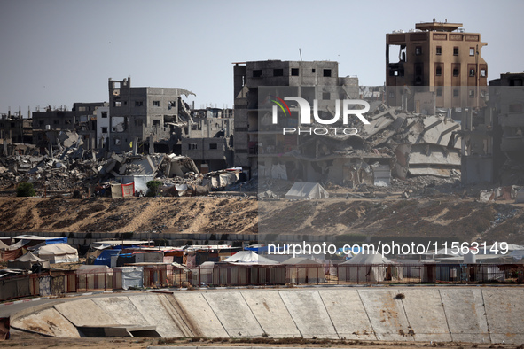 Displaced Palestinians shelter in a tent camp amid the Israel-Hamas conflict in the Al-Mawasi area in Khan Younis, in the southern Gaza Stri...