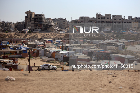 Displaced Palestinians shelter in a tent camp amid the Israel-Hamas conflict in the Al-Mawasi area in Khan Younis, in the southern Gaza Stri...