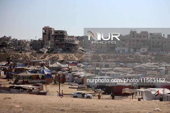 Displaced Palestinians shelter in a tent camp amid the Israel-Hamas conflict in the Al-Mawasi area in Khan Younis, in the southern Gaza Stri...