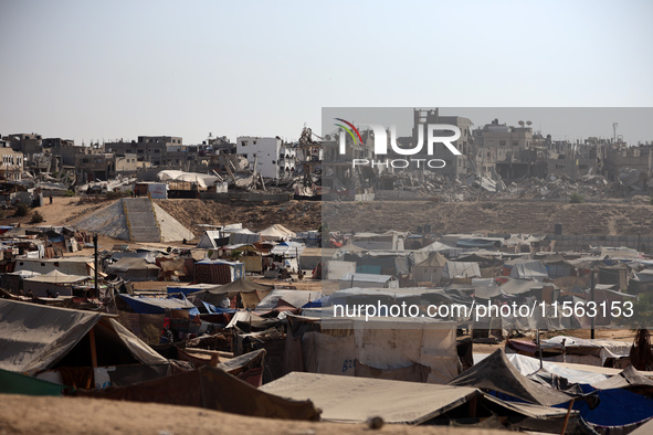 Displaced Palestinians shelter in a tent camp amid the Israel-Hamas conflict in the Al-Mawasi area in Khan Younis, in the southern Gaza Stri...