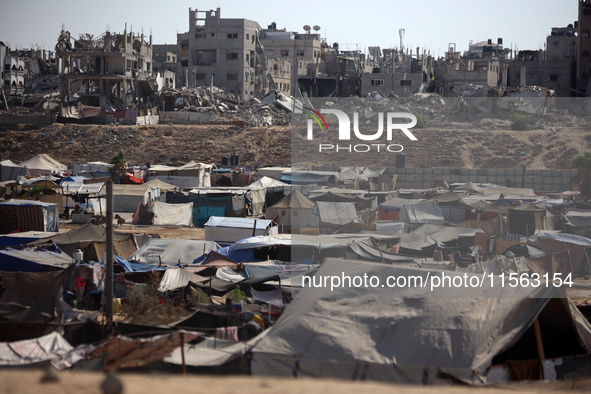 Displaced Palestinians shelter in a tent camp amid the Israel-Hamas conflict in the Al-Mawasi area in Khan Younis, in the southern Gaza Stri...