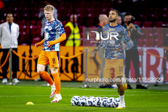 Netherlands forward Cody Gakpo and Netherlands midfielder Jerdy Schouten during the match between the Netherlands and Germany at the Johan C...