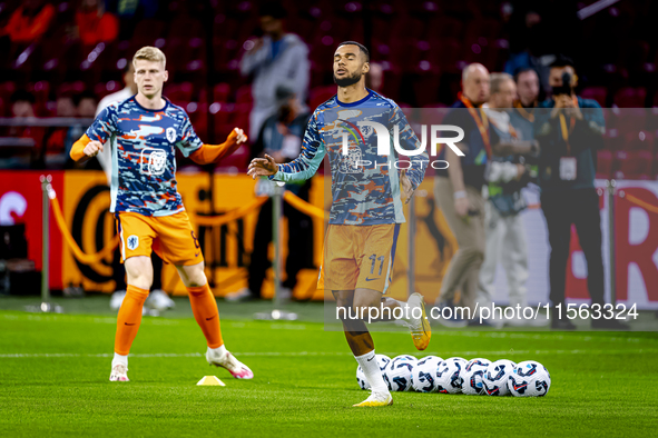 Netherlands forward Cody Gakpo and Netherlands midfielder Jerdy Schouten during the match between the Netherlands and Germany at the Johan C...