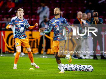 Netherlands forward Cody Gakpo and Netherlands midfielder Jerdy Schouten during the match between the Netherlands and Germany at the Johan C...