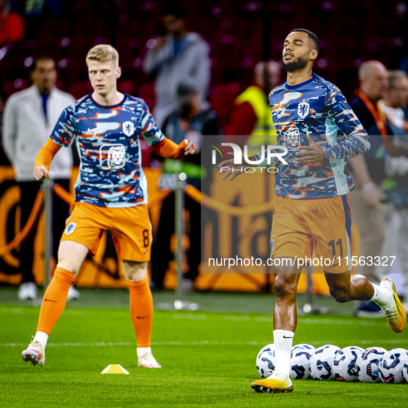 Netherlands forward Cody Gakpo and Netherlands midfielder Jerdy Schouten during the match between the Netherlands and Germany at the Johan C...