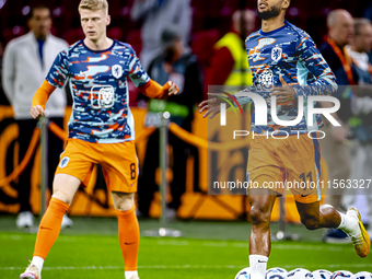 Netherlands forward Cody Gakpo and Netherlands midfielder Jerdy Schouten during the match between the Netherlands and Germany at the Johan C...