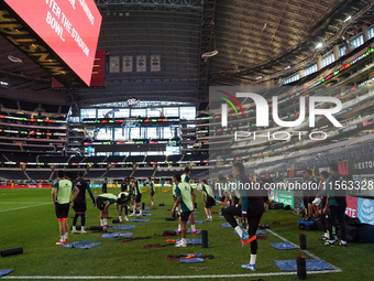 Members of the Mexican national soccer team train during media day before the match against Team Canada at the AT&T Stadium in Arlington, Te...