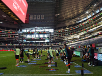 Members of the Mexican national soccer team train during media day before the match against Team Canada at the AT&T Stadium in Arlington, Te...