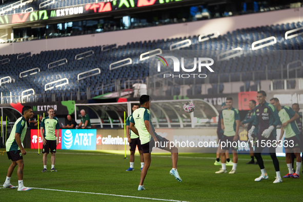 Members of the Mexican national soccer team train during media day before the match against Team Canada at the AT&T Stadium in Arlington, Te...