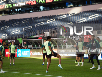 Members of the Mexican national soccer team train during media day before the match against Team Canada at the AT&T Stadium in Arlington, Te...