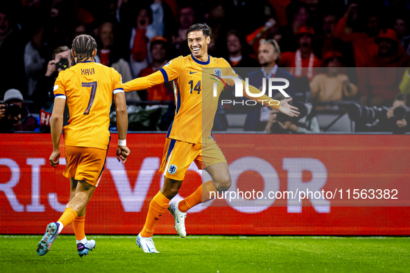 Netherlands midfielder Tijani Reijnders scores the 1-0 and celebrates the goal during the match between the Netherlands and Germany at the J...