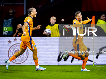 Netherlands midfielder Tijani Reijnders scores the 1-0 and celebrates the goal during the match between the Netherlands and Germany at the J...