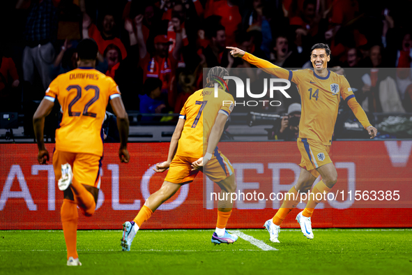 Netherlands midfielder Tijani Reijnders scores the 1-0 and celebrates the goal during the match between the Netherlands and Germany at the J...