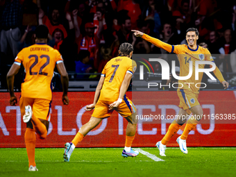 Netherlands midfielder Tijani Reijnders scores the 1-0 and celebrates the goal during the match between the Netherlands and Germany at the J...