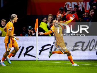 Netherlands midfielder Tijani Reijnders scores the 1-0 and celebrates the goal during the match between the Netherlands and Germany at the J...