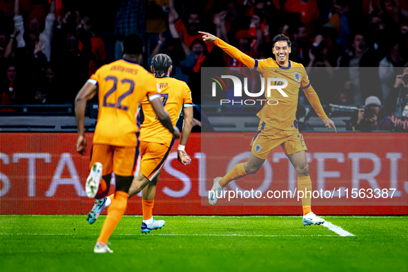 Netherlands midfielder Tijani Reijnders scores the 1-0 and celebrates the goal during the match between the Netherlands and Germany at the J...