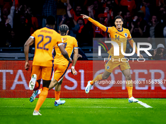 Netherlands midfielder Tijani Reijnders scores the 1-0 and celebrates the goal during the match between the Netherlands and Germany at the J...