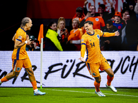 Netherlands midfielder Tijani Reijnders scores the 1-0 and celebrates the goal during the match between the Netherlands and Germany at the J...