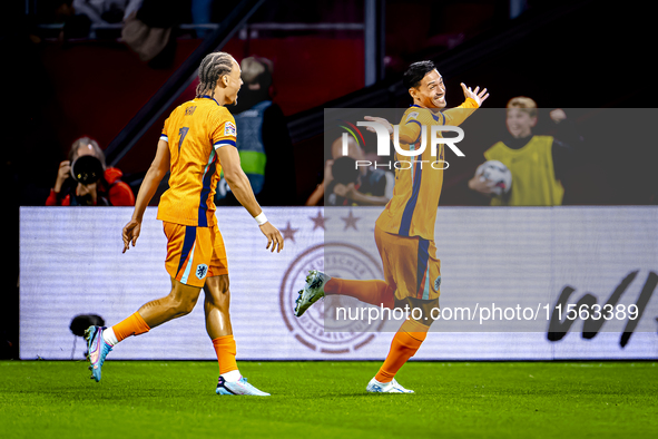 Netherlands midfielder Tijani Reijnders scores the 1-0 and celebrates the goal during the match between the Netherlands and Germany at the J...